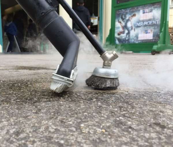 after results of scrubbing and steam cleaning chewing gum removal off of stoned pavement with the powerfull Pure industrial steam cleaner